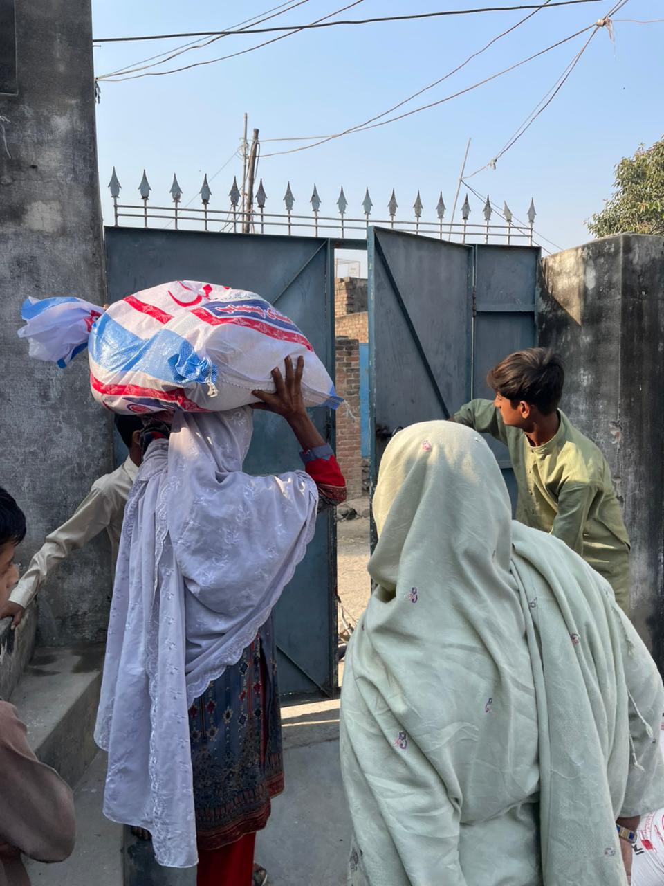 Sukoon Zameen volunteers delivering essential support to a family